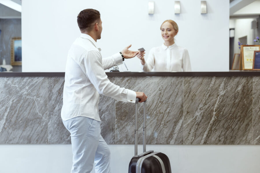 man at hotel reception.